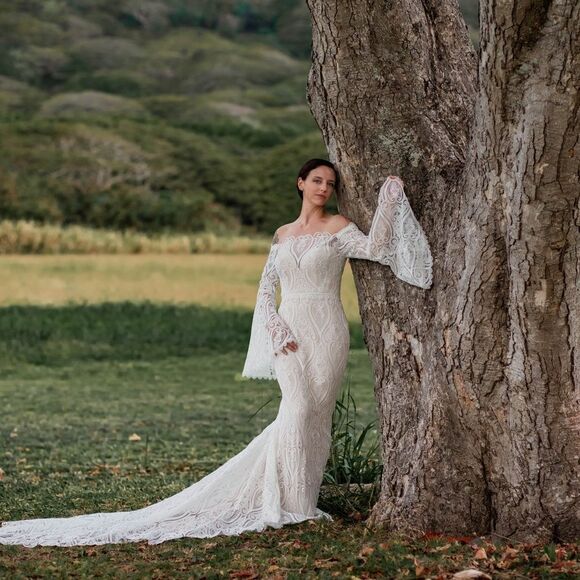 Mermaid wedding dress with bell sleeves and crochet lace off the Shoulder